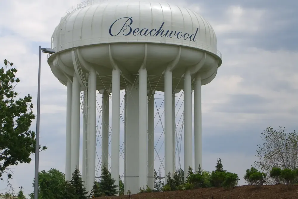 Beachwood water tower among trees under a cloudy sky in Beachwood, Ohio