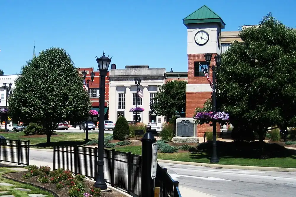 Clock tower, lamp posts and flower beds at the downtown triangle in Berea, Ohio
