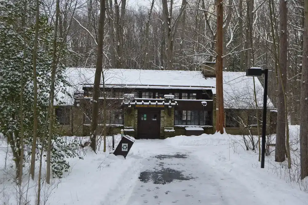 Stone Trailside Museum building in the snowy woods of the Brecksville Reservation, Brecksville, Ohio