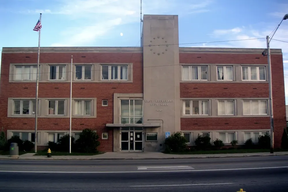 Brick East Cleveland City Hall building with a flagpole in East Cleveland, Ohio