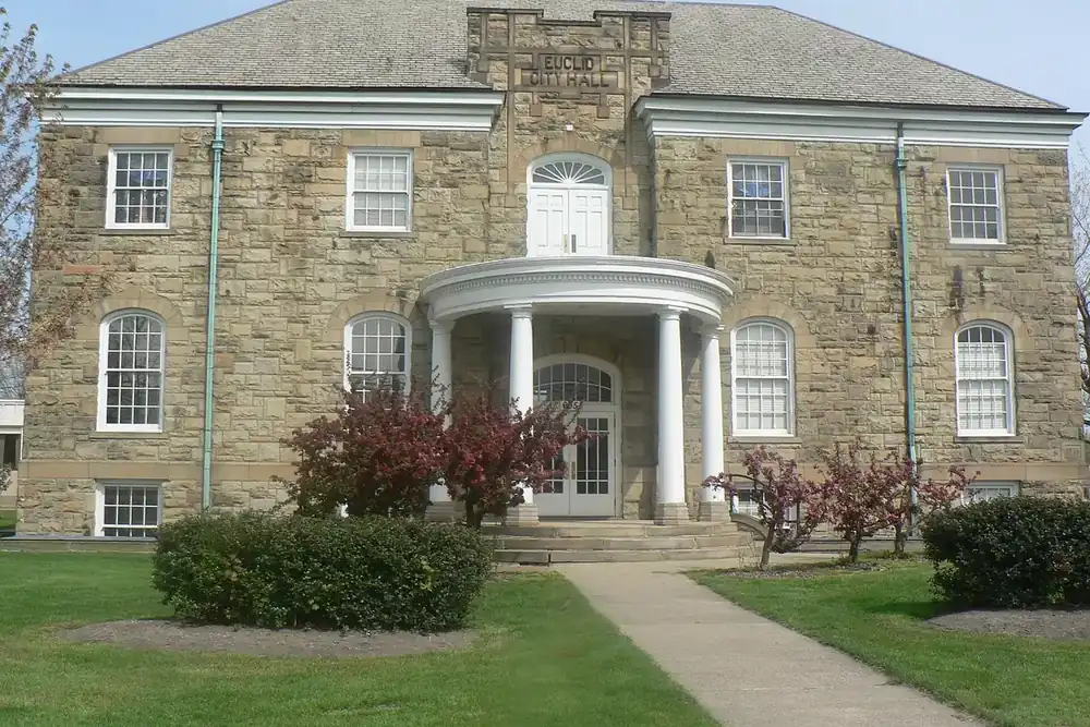 Sandstone Old City Hall with a columned entrance in Euclid, Ohio