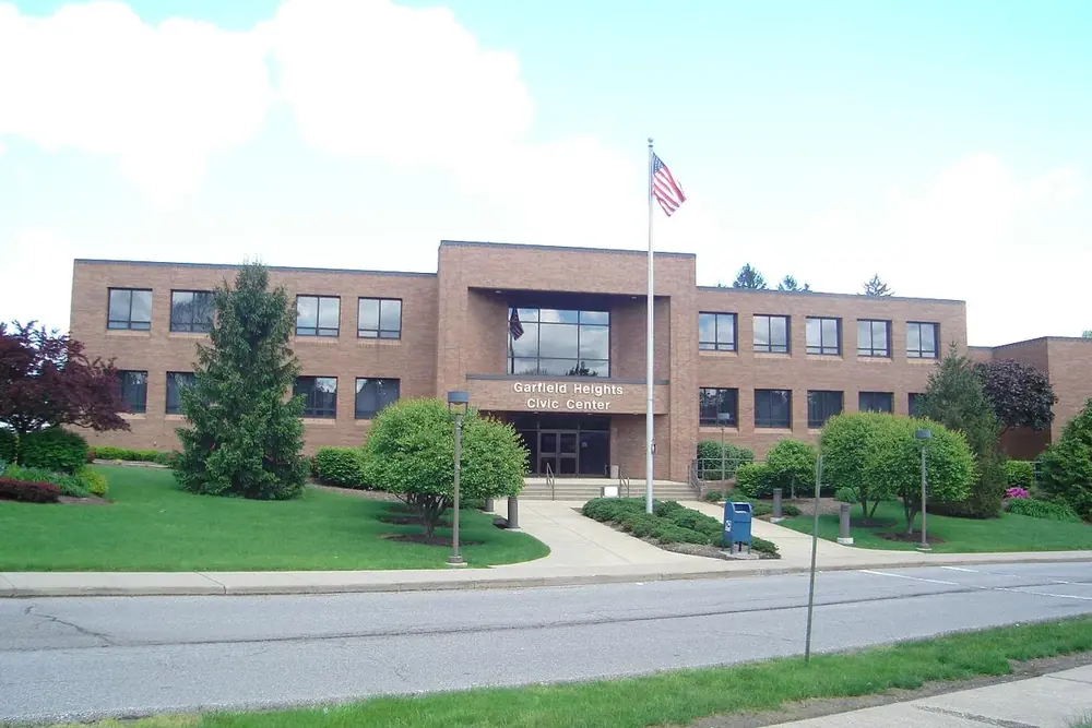 Garfield Heights City Hall and Civic Center with a flagpole and green lawn, Ohio