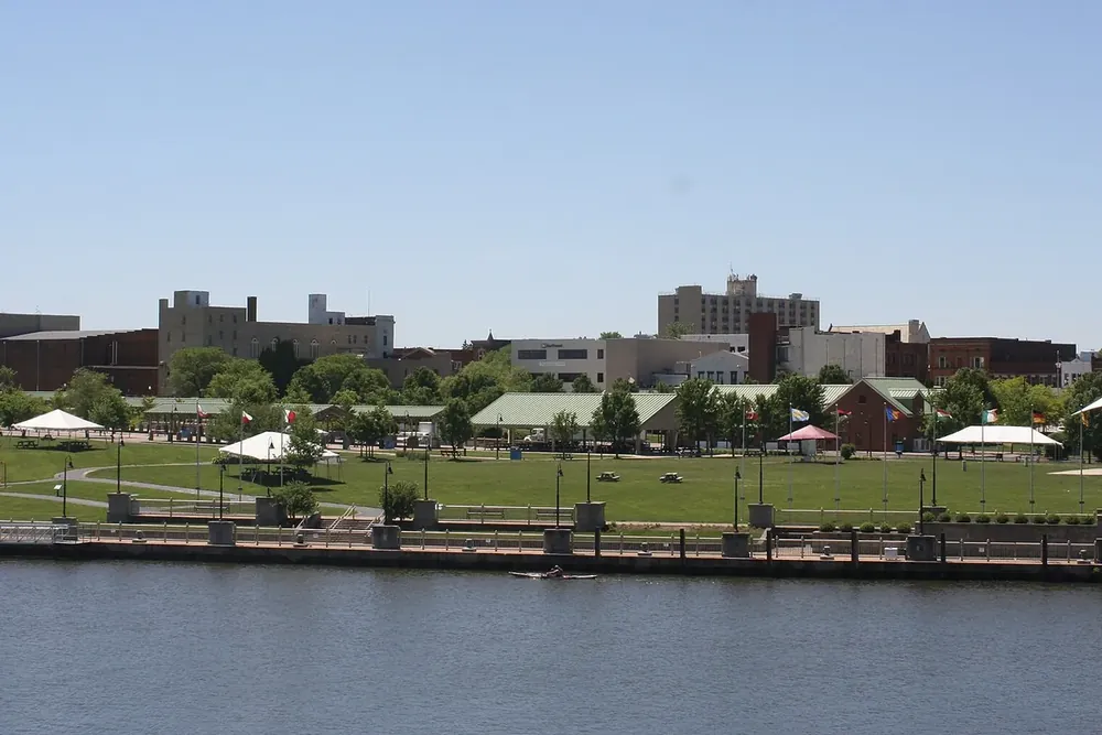 Downtown Lorain buildings and a riverside park across the Black River in Lorain, Ohio