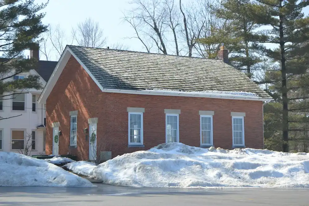 Old Euclid District 4 brick schoolhouse in winter snow in Lyndhurst, Ohio