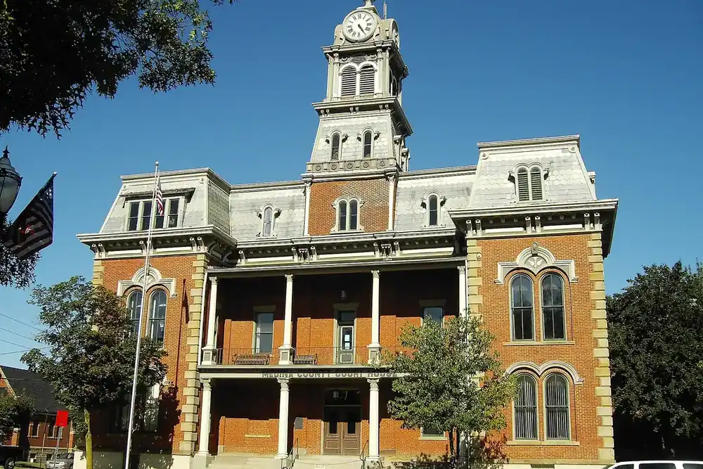 The historic Medina County Courthouse with its clock tower on a sunny day in Medina, Ohio