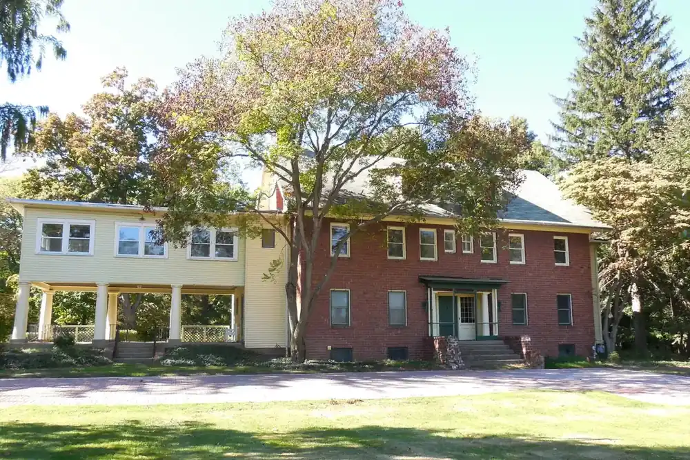 Main house at Greenwood Farm among autumn trees in Richmond Heights, Ohio