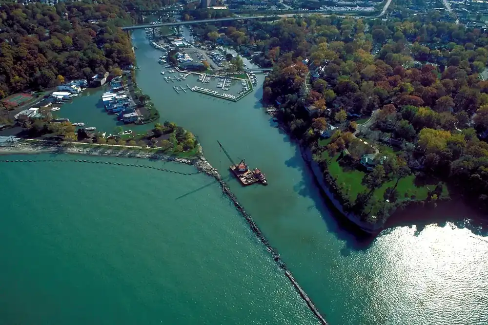 Aerial view of the Rocky River harbor meeting Lake Erie among autumn trees, Rocky River, Ohio